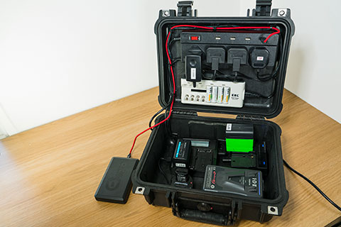 Charging case for camera batteries