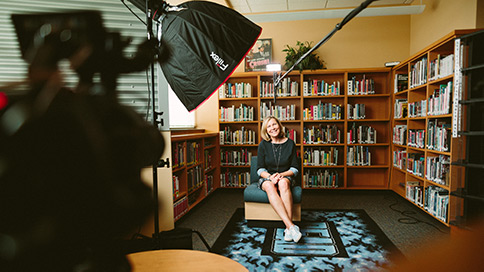 Filmmaker filming an interview