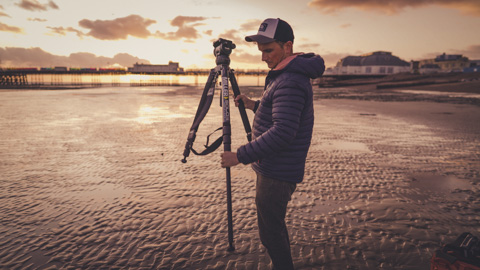 Lowering the leg of a tripod